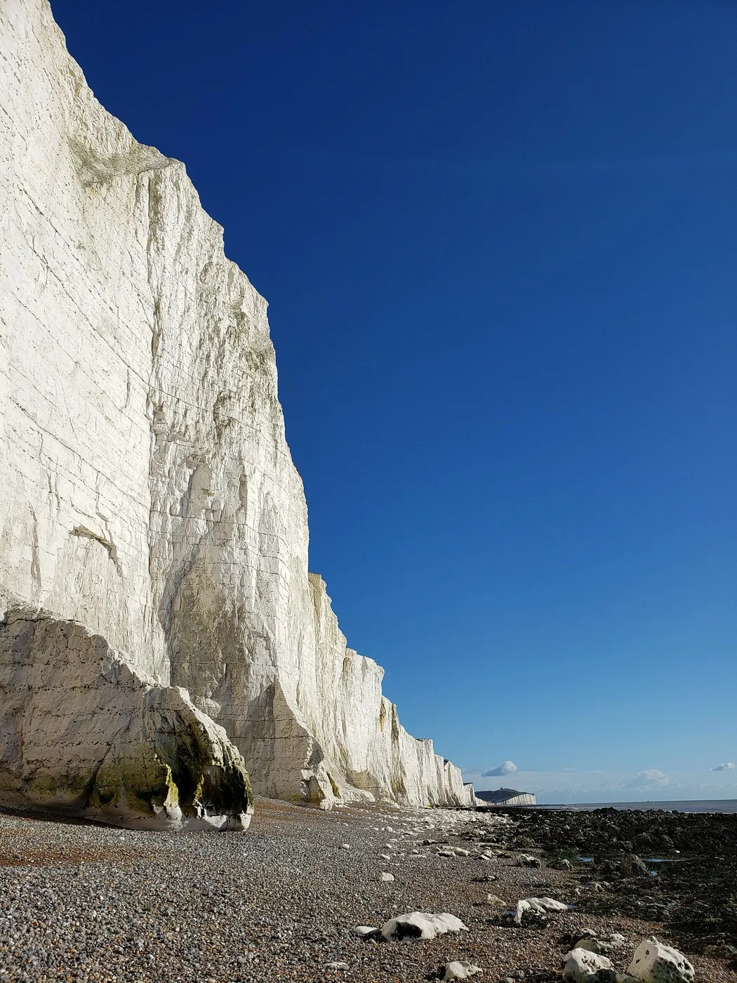 Looking up at the Seven Sisters cliffs from the base — keep your distance